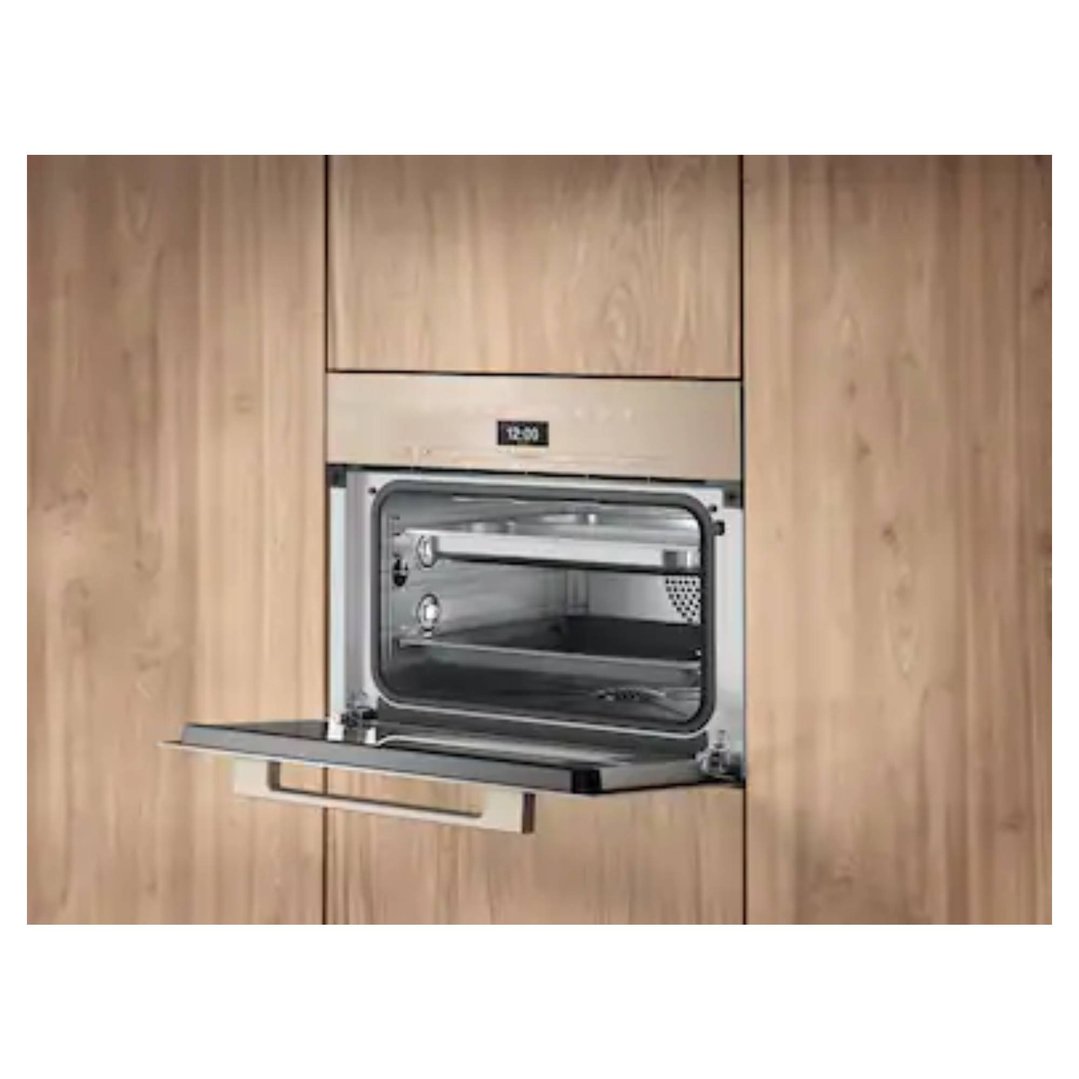 Combination steam oven with door open, built into light wood cabinetry