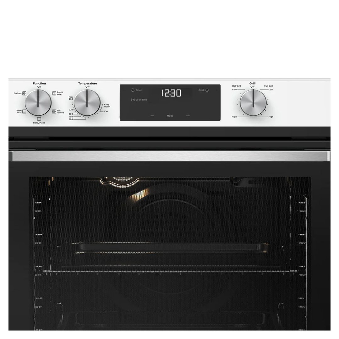 A close-up of the oven's control panel and interior with the door open