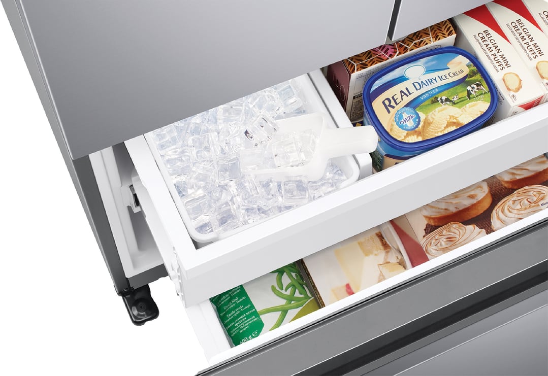 Open freezer drawer of a French door refrigerator with ice, ice cream, and pastries