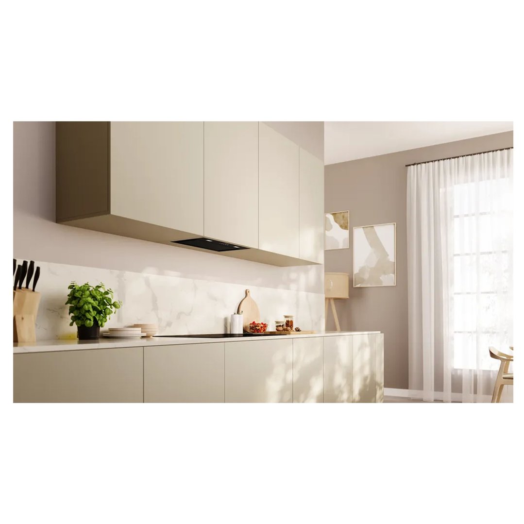 Integrated rangehood in a modern kitchen with light cabinets and marble backsplash