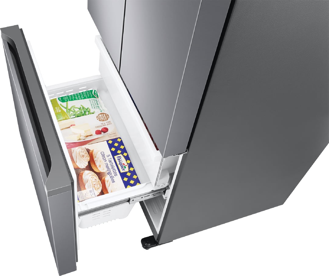 Open bottom drawer of a SAMSUNG French Door Refrigerator with food items