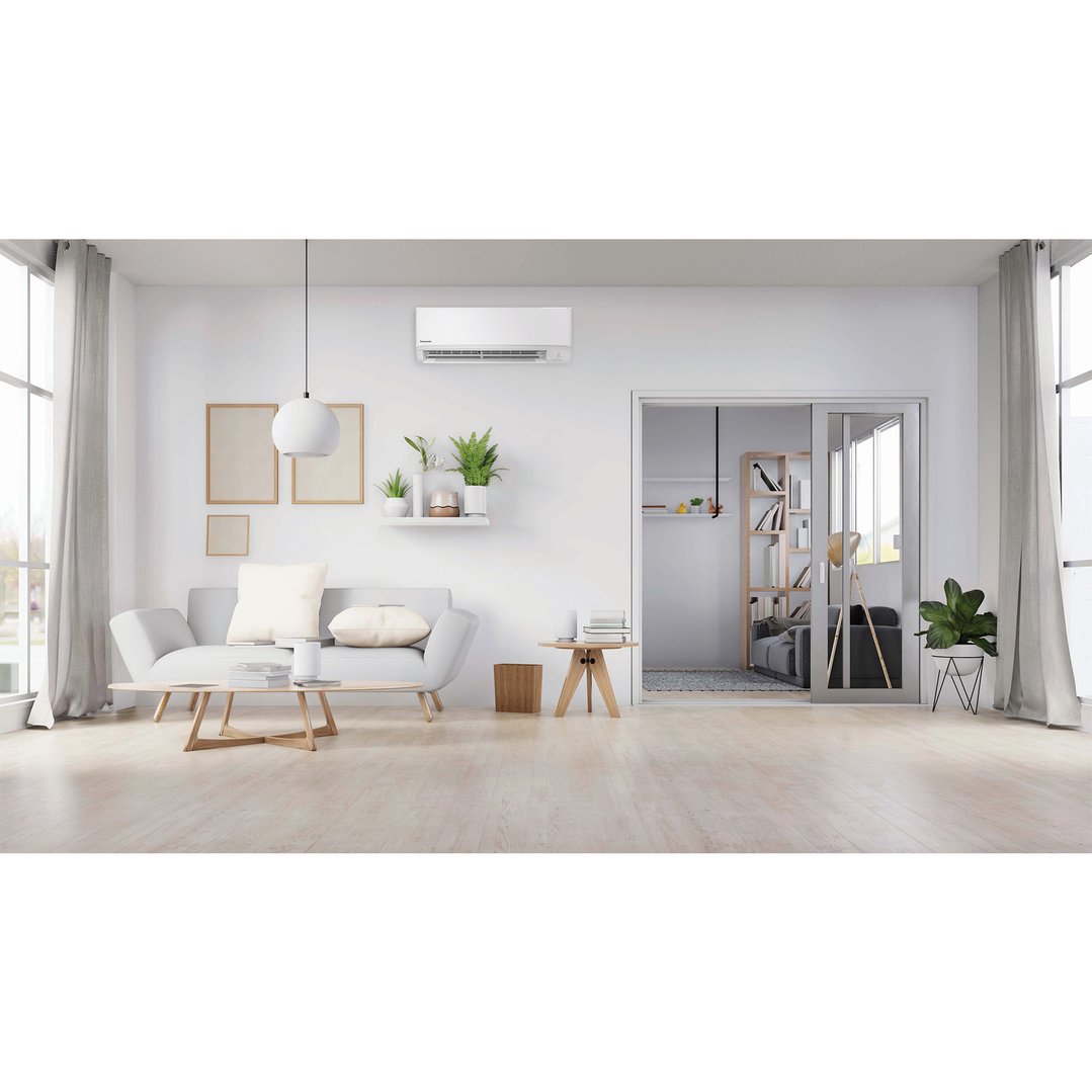 White Panasonic air conditioner mounted on a wall in a modern living room