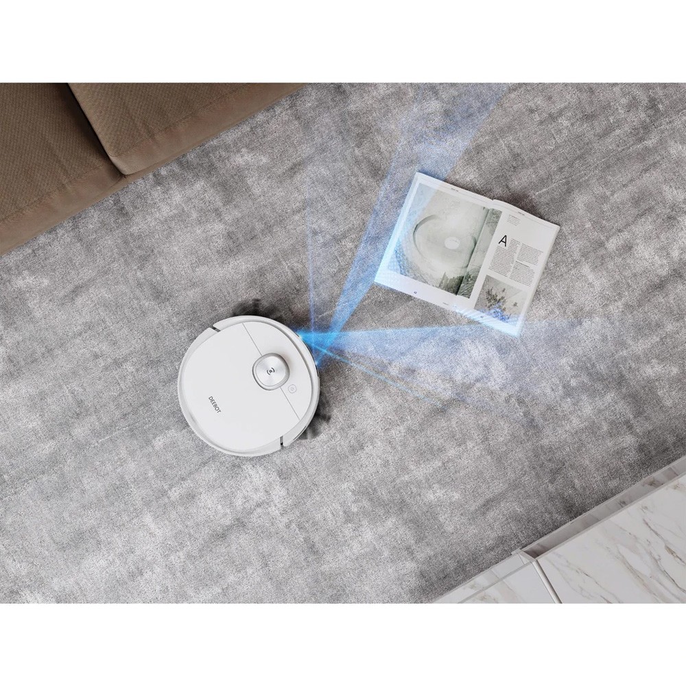 White robotic vacuum cleaner on a grey carpet with blue light beams