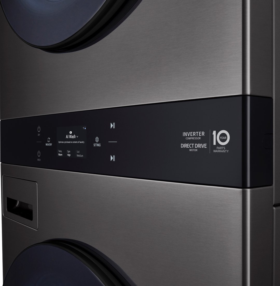 Close-up of the control panel of a stacked washer dryer in a dark setting