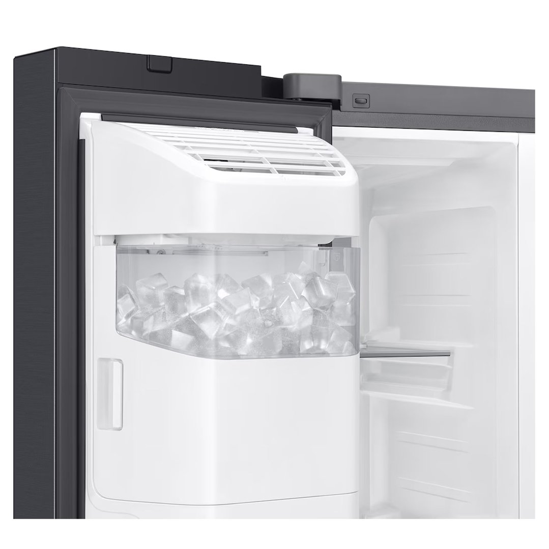 Close-up of the open refrigerator door showing the ice maker and ice bucket