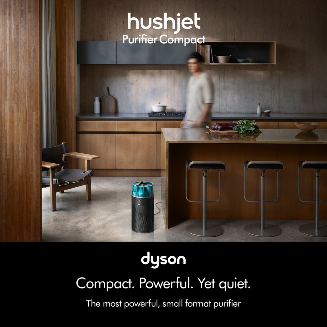 Dyson HushJet Purifier Compact in a modern kitchen with a person walking by