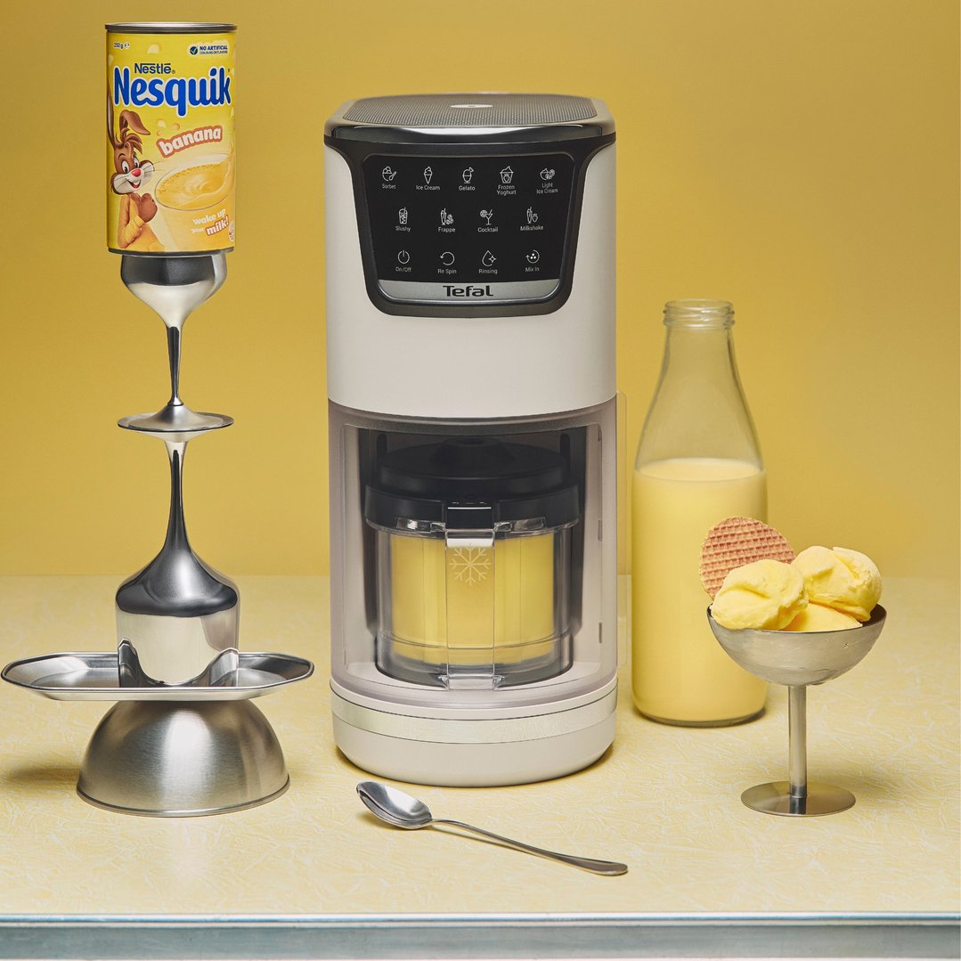 Tefal ice cream maker with Nesquik banana powder and ice cream in a styled setting