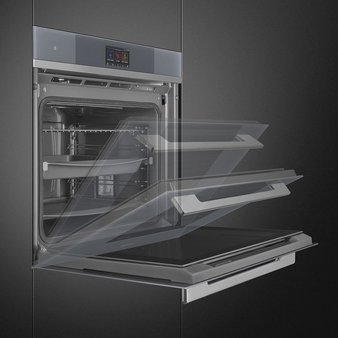 Built-in oven with door opening in multiple positions, dark background