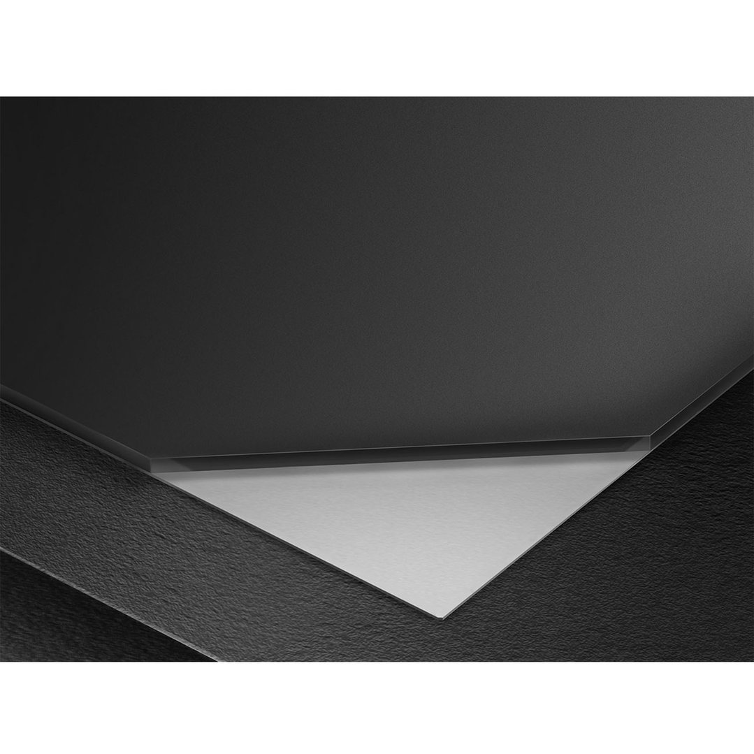 Close up of a black cooktop with a silver burner base
