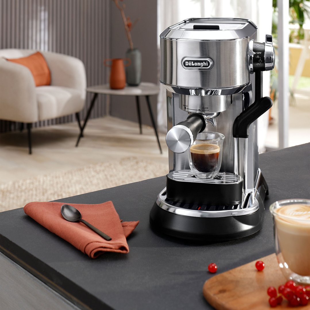 DeLonghi Dedica Maestro Plus manual coffee machine making espresso in a modern kitchen