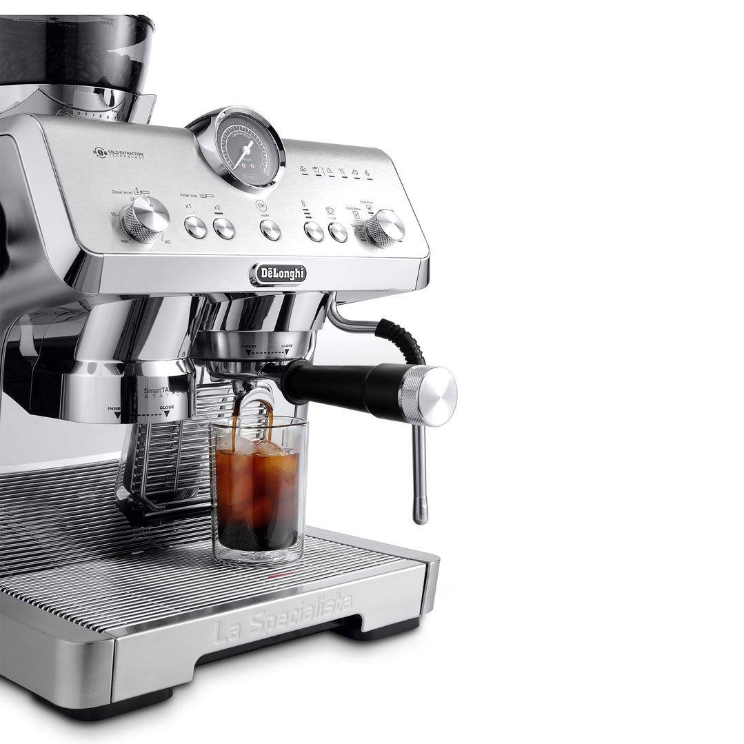 DeLonghi La Specialista Opera coffee maker dispensing into a glass with ice