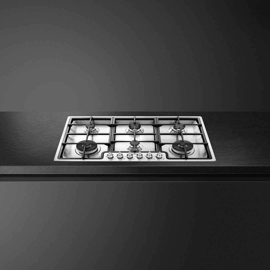 SMEG 90cm 6 burner gas cooktop in a dark kitchen setting