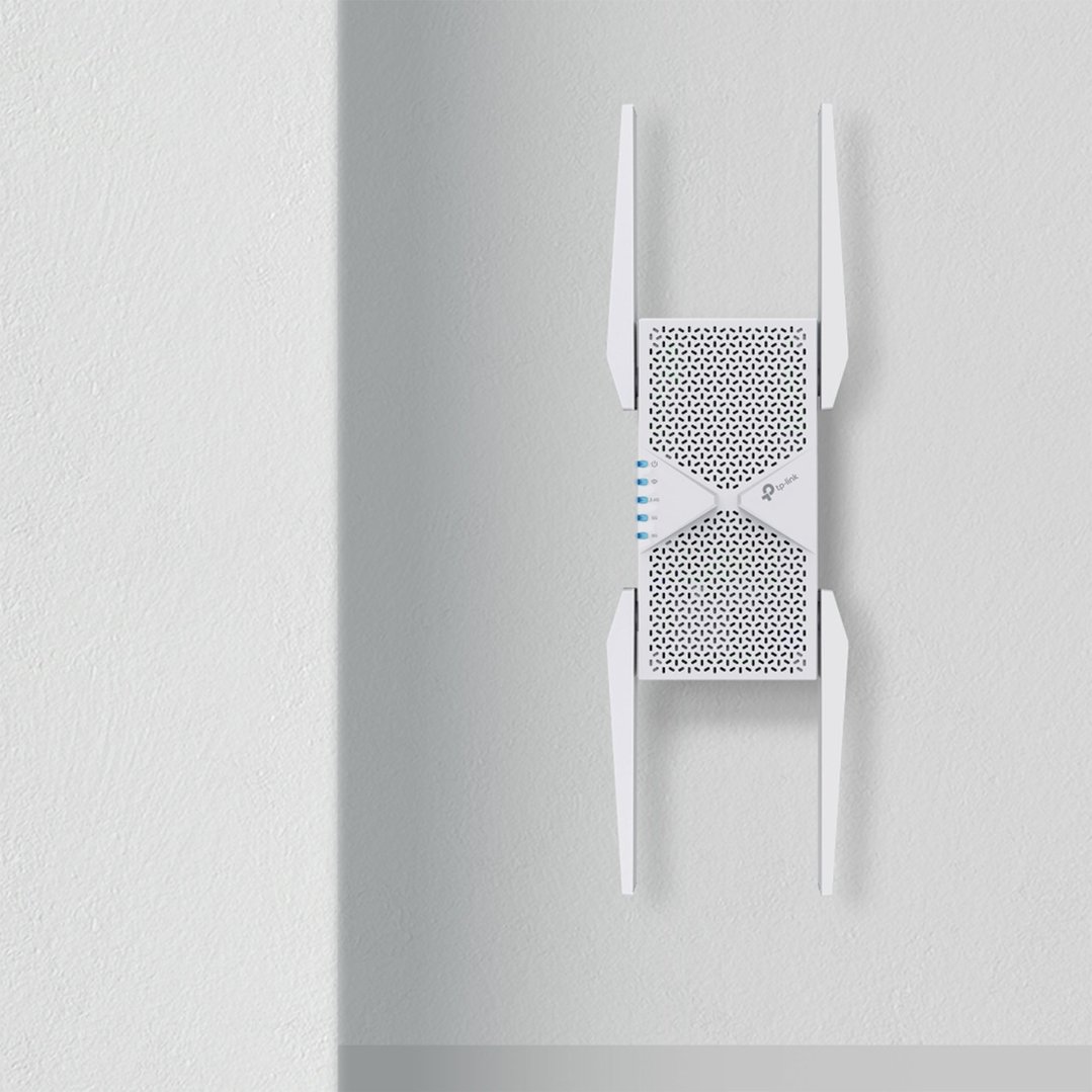 TP-Link BE9300 Tri-Band Wi-Fi 7 Range Extender mounted on a white wall