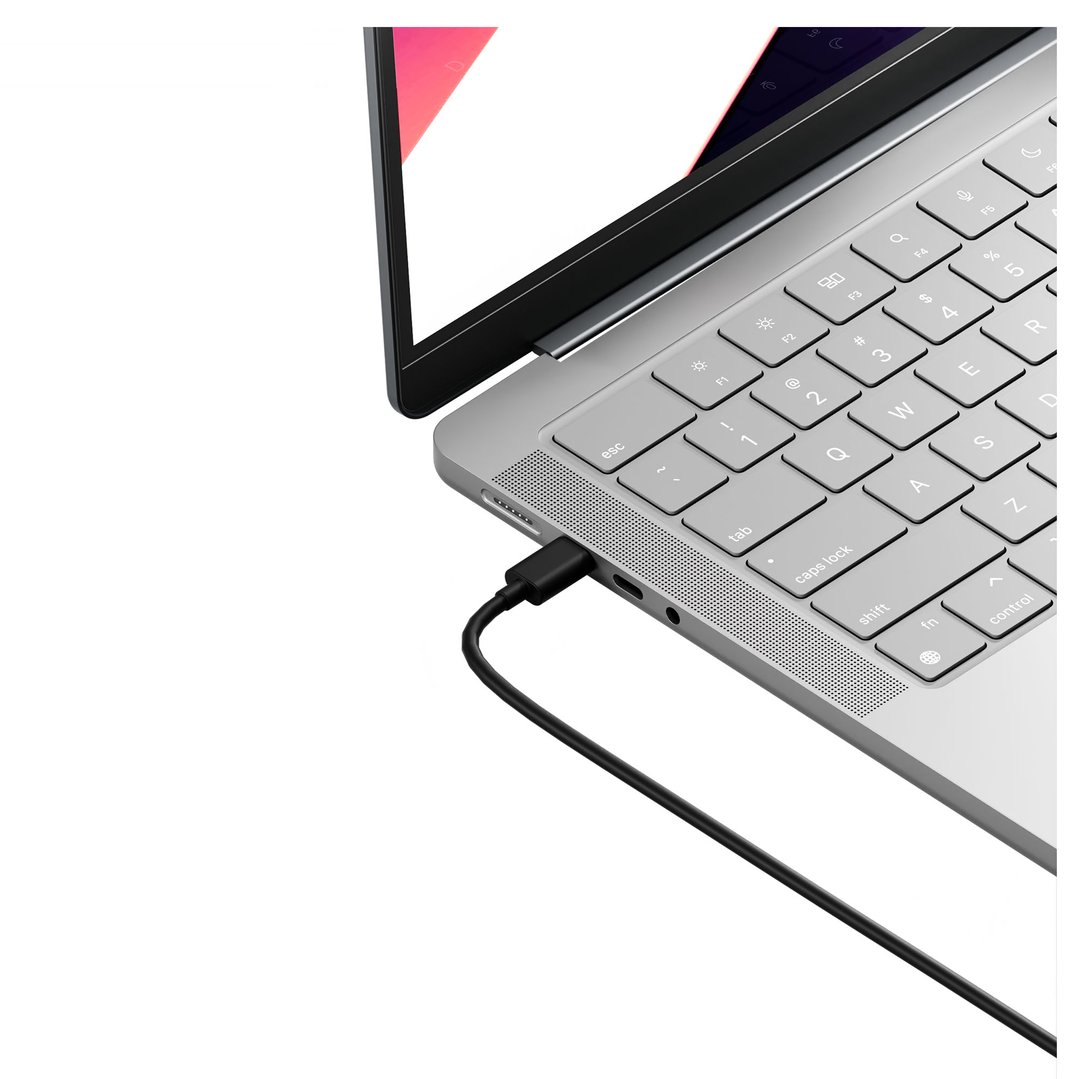 USB-C docking station connected to a laptop on a white background