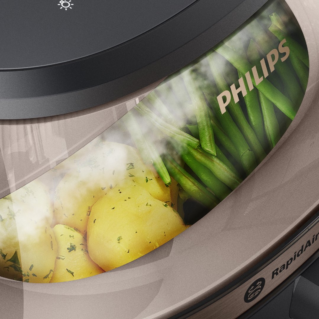 Close up of Philips airfryer with potatoes and green beans inside