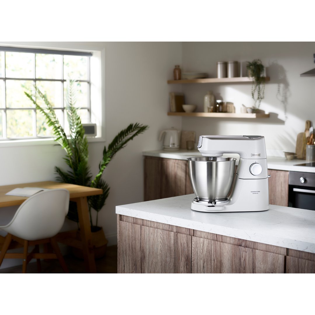 White Kenwood food mixer on a kitchen counter in a modern kitchen