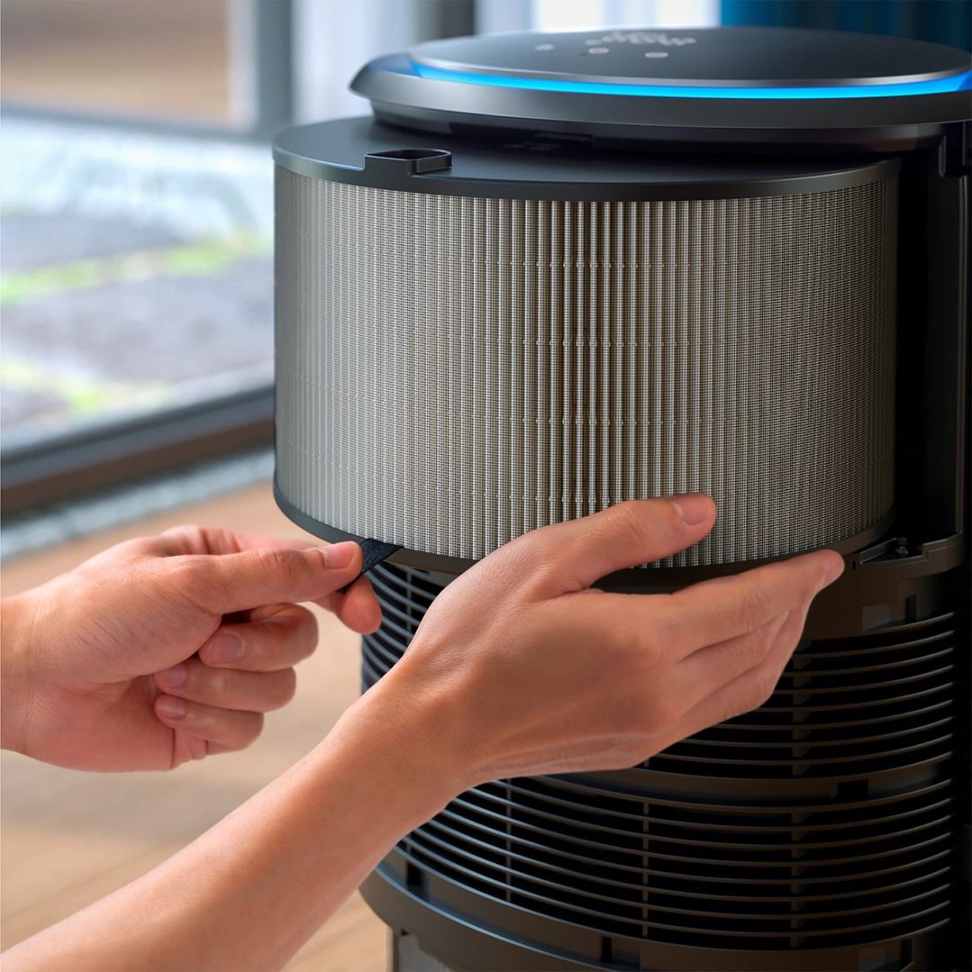 Hands removing the filter from a Philips air purifier