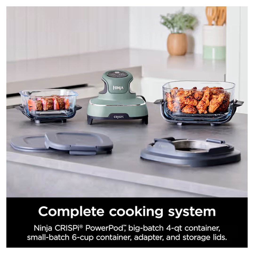 Ninja Crispi air fryer system with containers of food on a kitchen counter