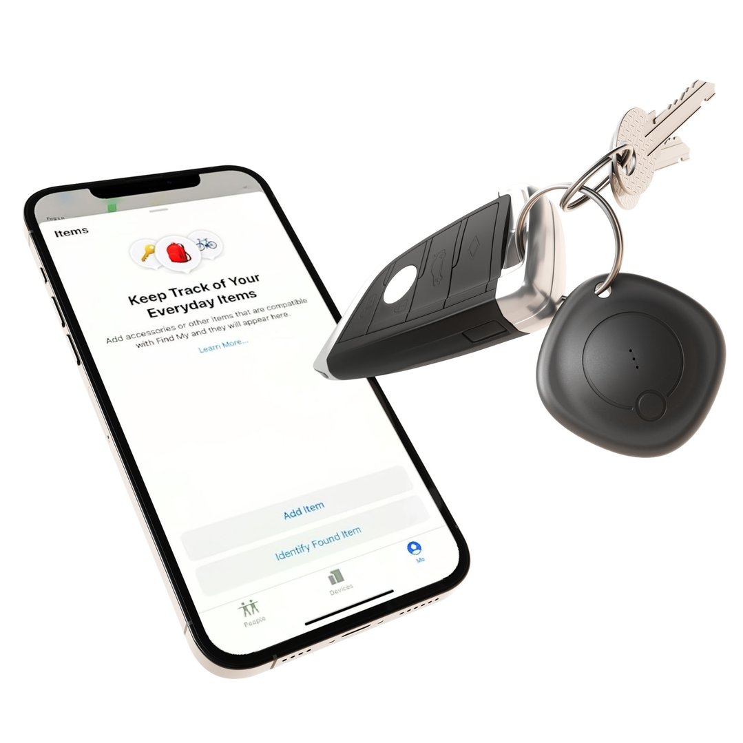 LOC8 Finder Fob attached to car keys next to a mobile phone