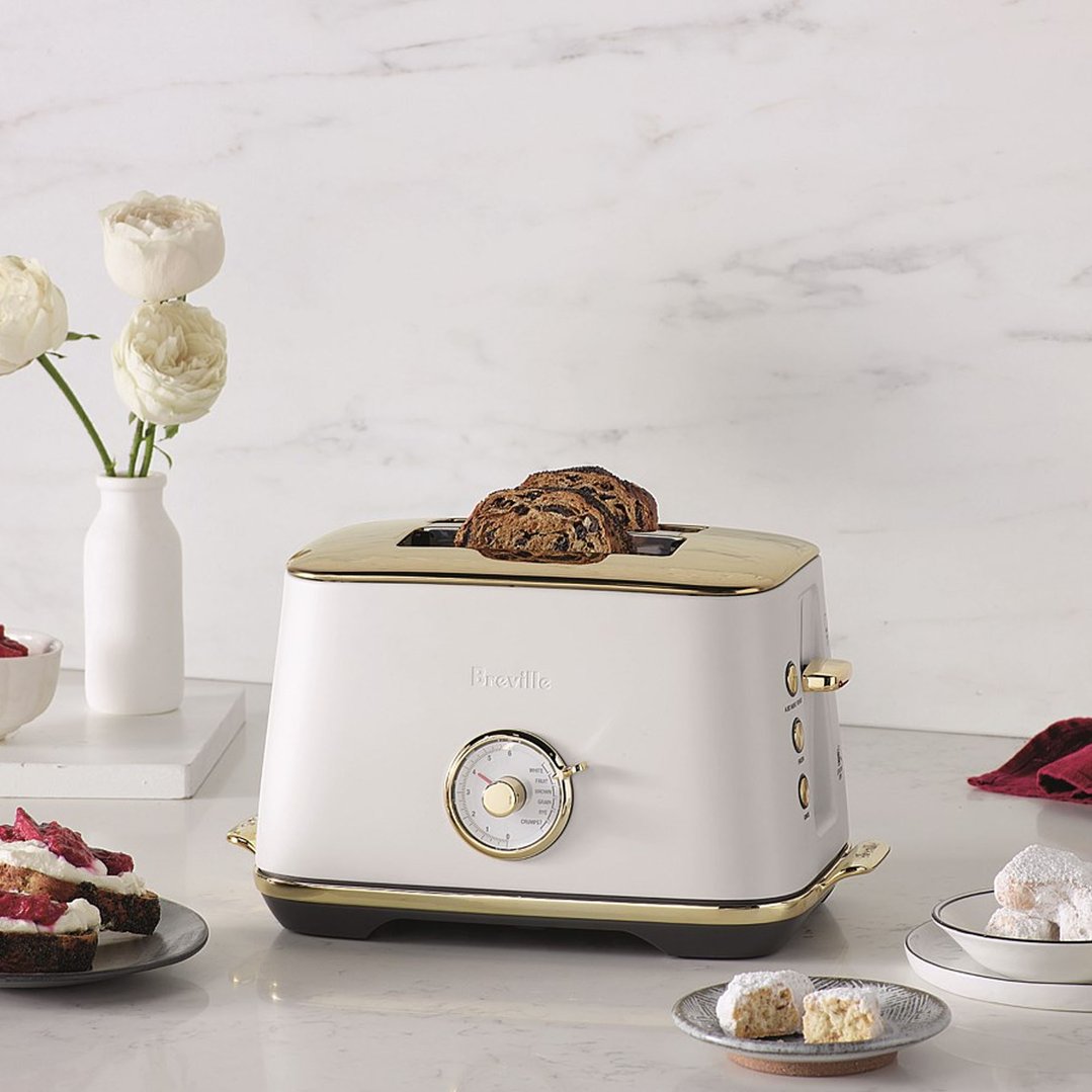 Breville Toast Select Luxe 2 Slice Toaster with toast in a kitchen setting