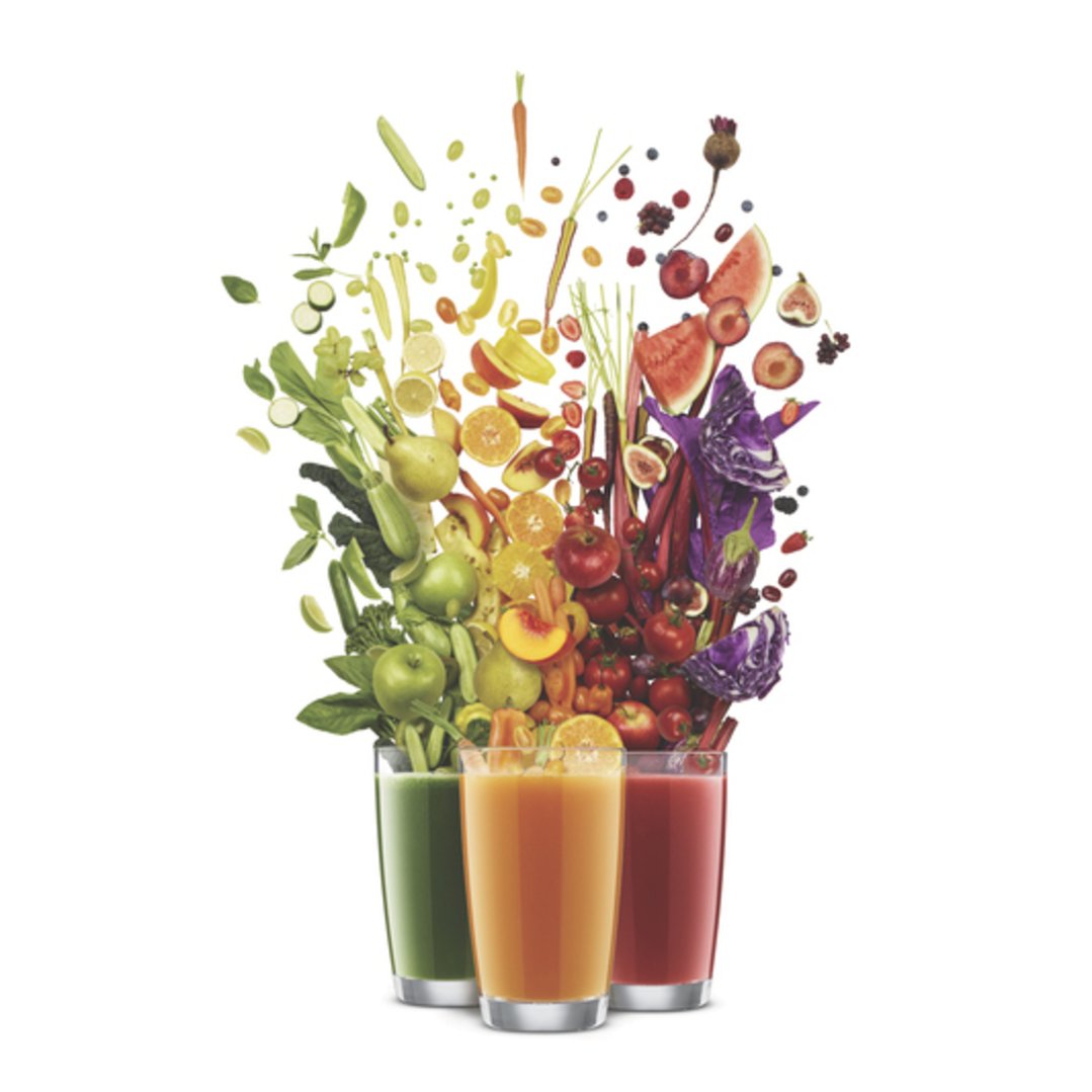 Three glasses of juice with a rainbow of fruits and vegetables above