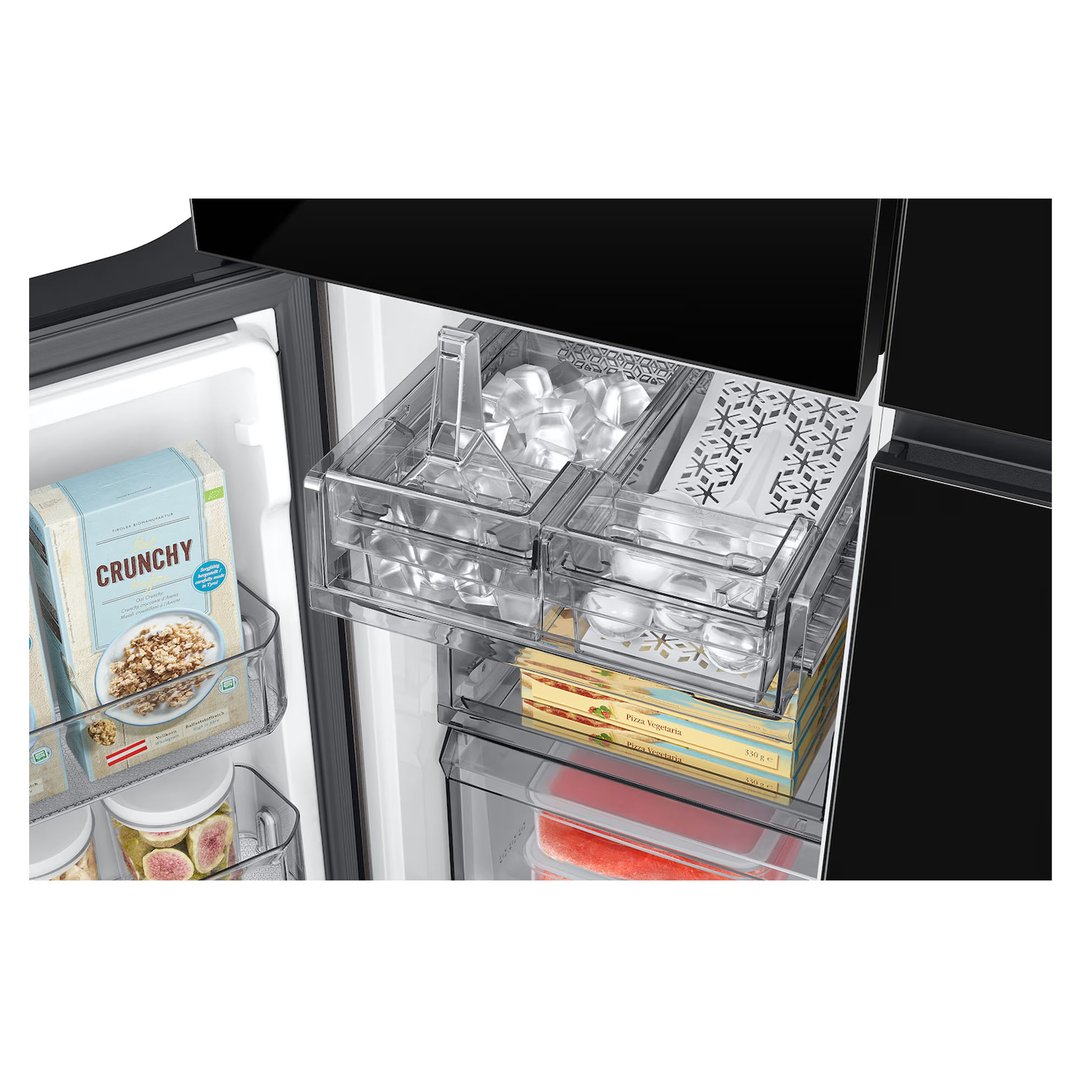 Interior view of a black 4-door French door refrigerator with food items