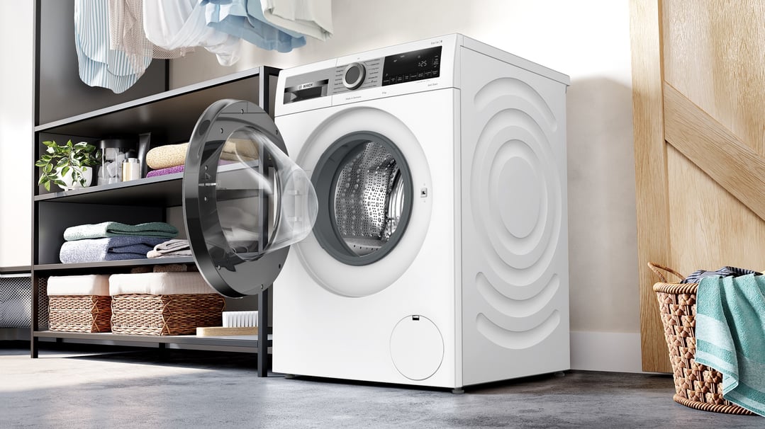 A white Bosch 9kg Series 8 Front Loader Washing Machine with its door open