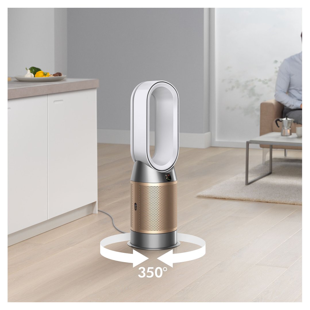 Dyson Hot+Cool HP2 De-NOx Purifier in a living room with a person sitting