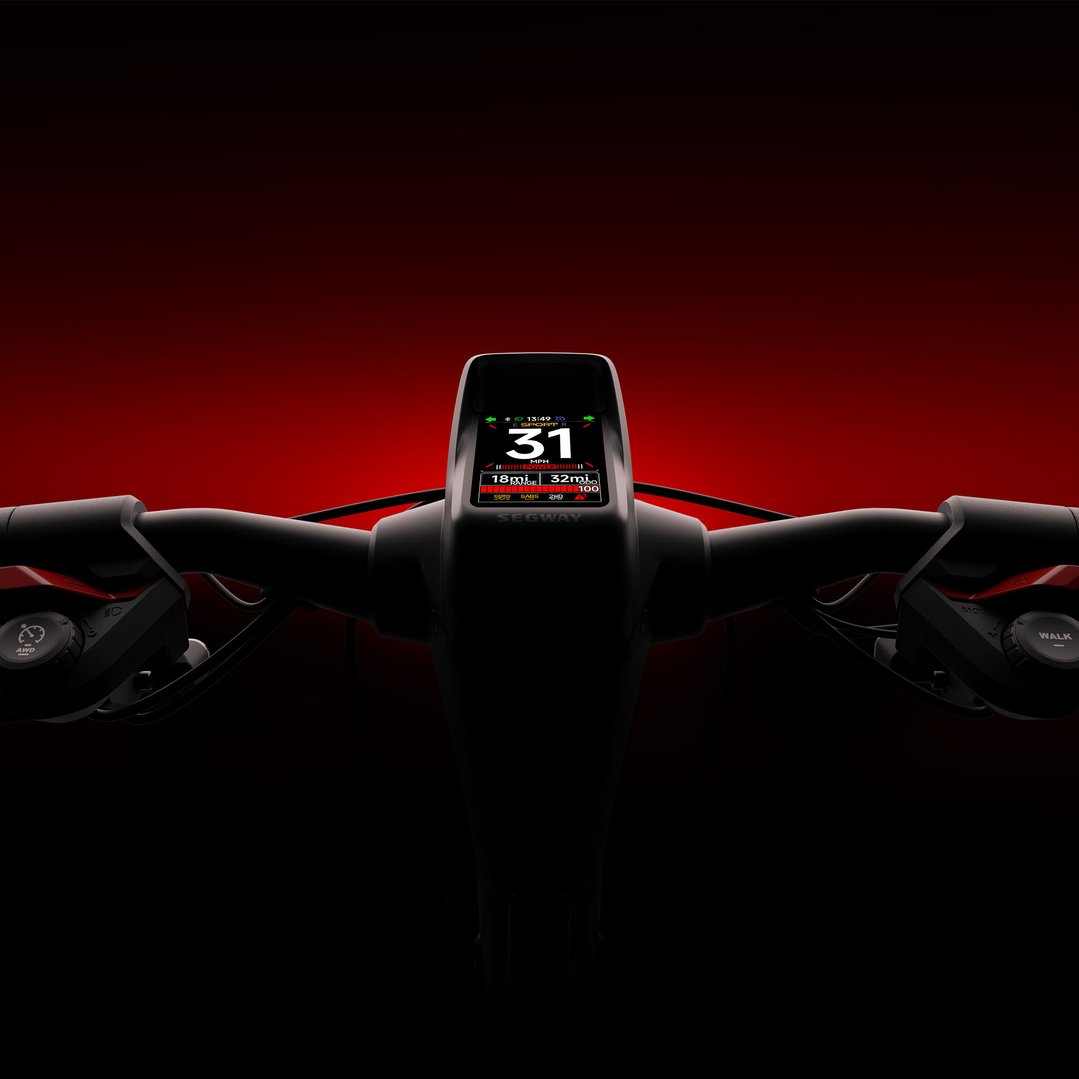 Close-up of an electric scooter's handlebars and digital display against a red background