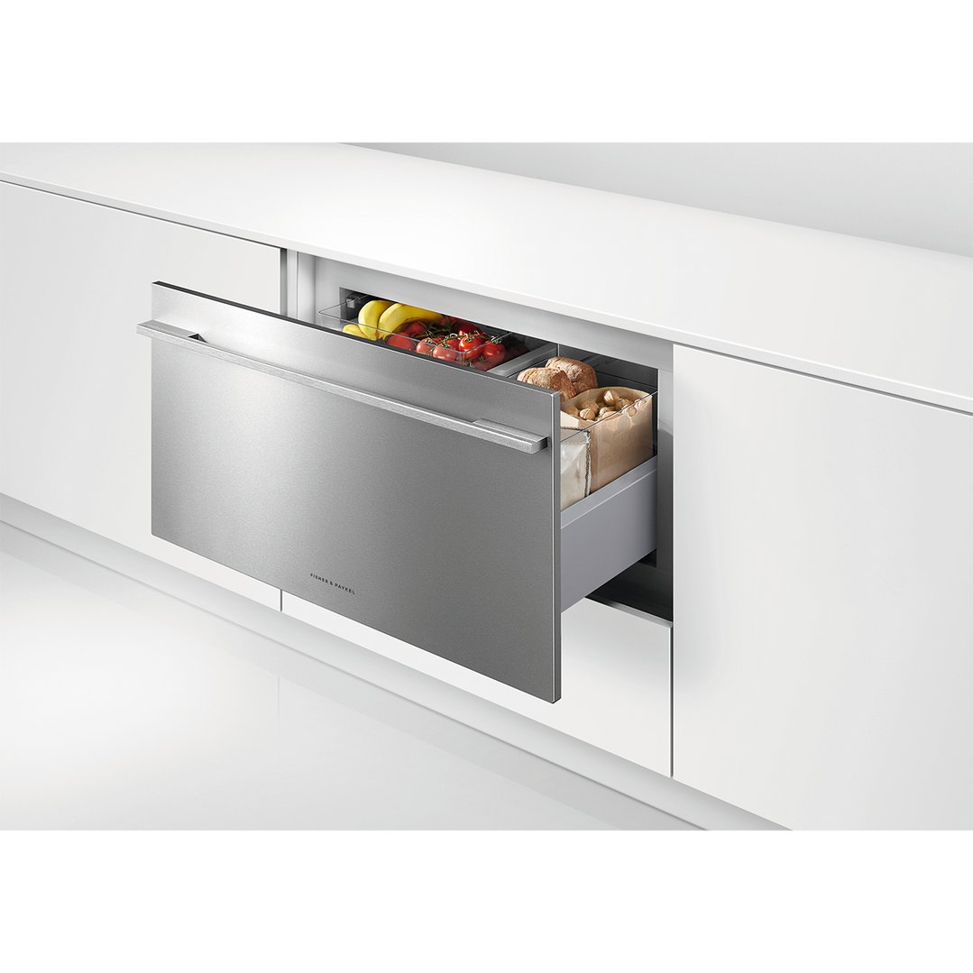 Integrated CoolDrawer multi-temperature drawer with fresh food inside, built into white cabinetry