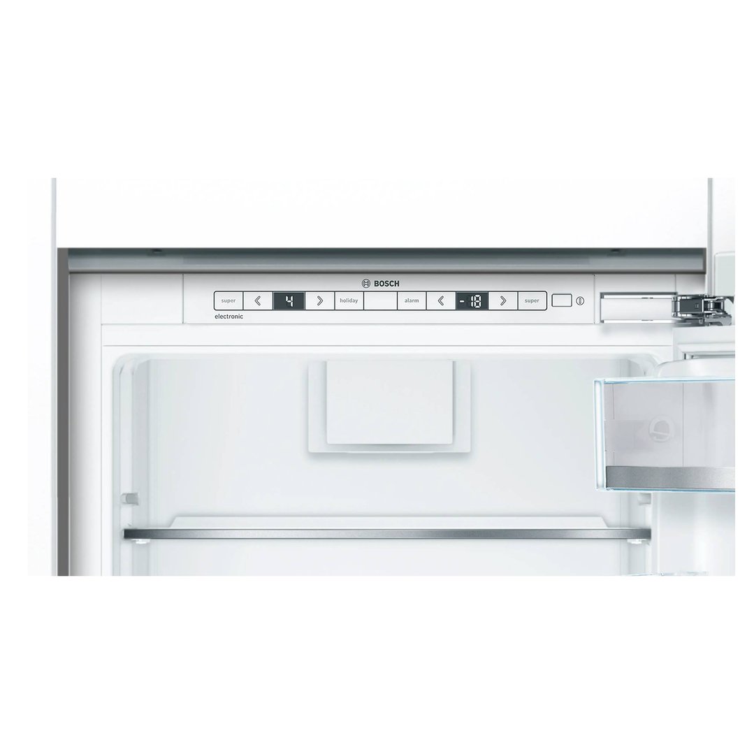 Close-up of the interior of a built-in fridge-freezer with digital controls