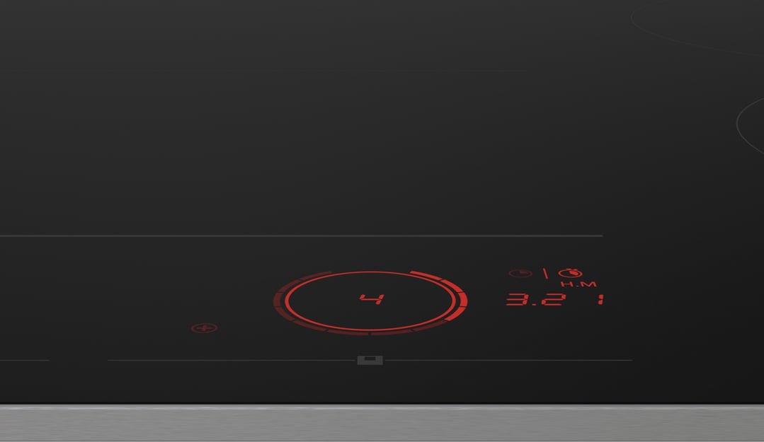 Close up of an ASKO AGENCY induction cooktop with red digital display