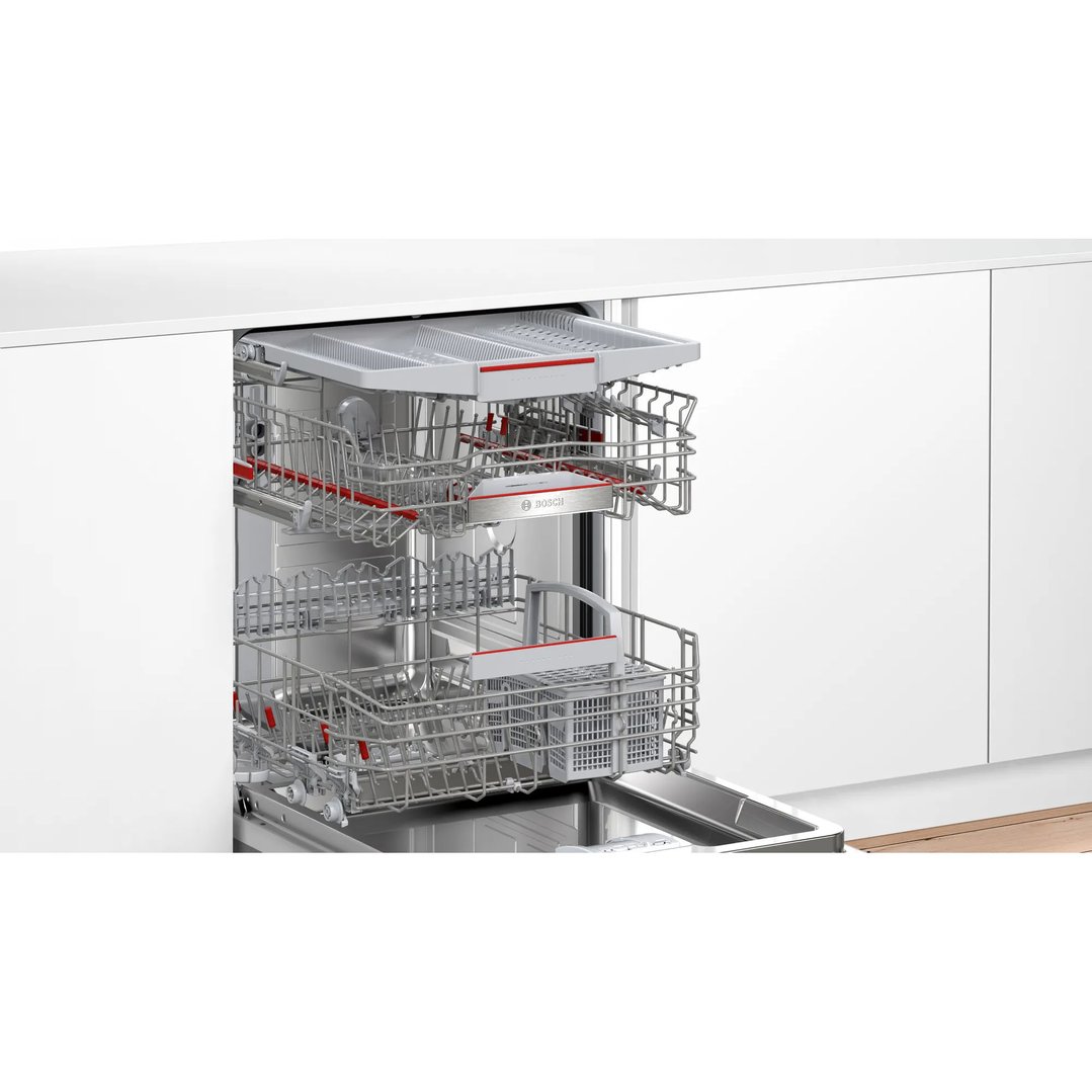 Open dishwasher with racks pulled out in a modern kitchen setting