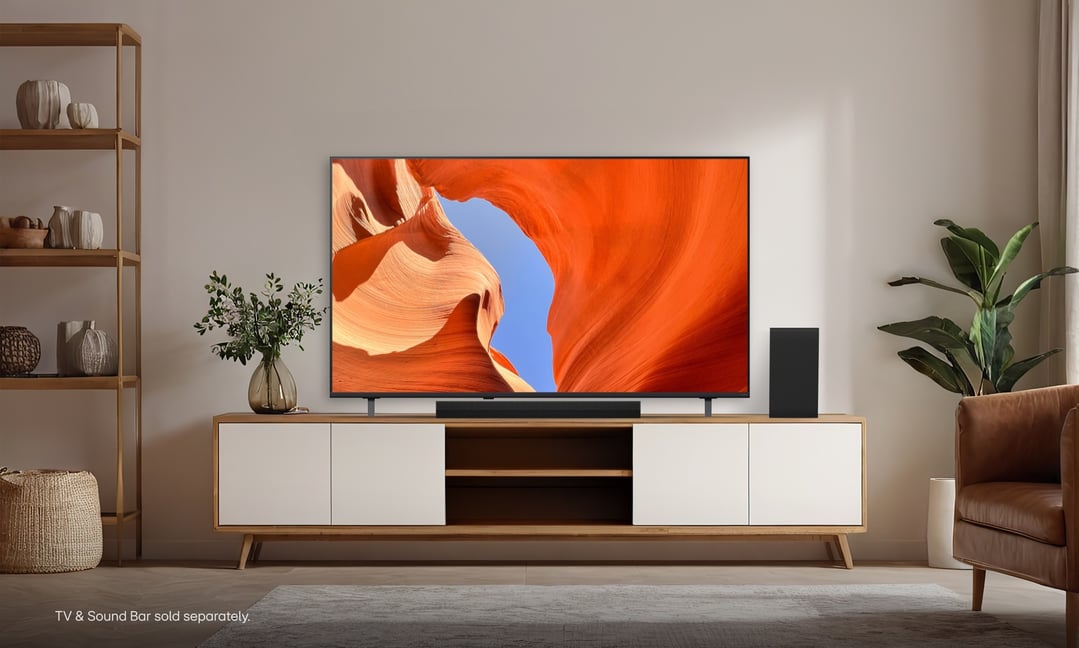 LG 55 inch QNED70B 4K AI Mini LED Smart TV on a wooden cabinet