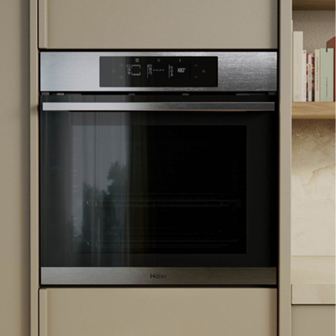 A built-in Haier oven with a digital display in a modern kitchen setting