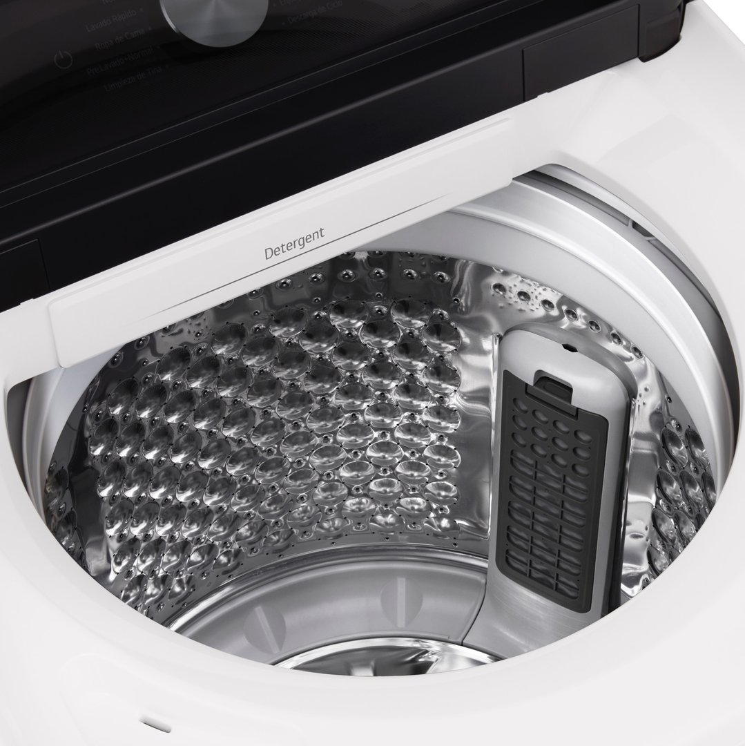 Close-up view inside the drum of a white top-load washing machine