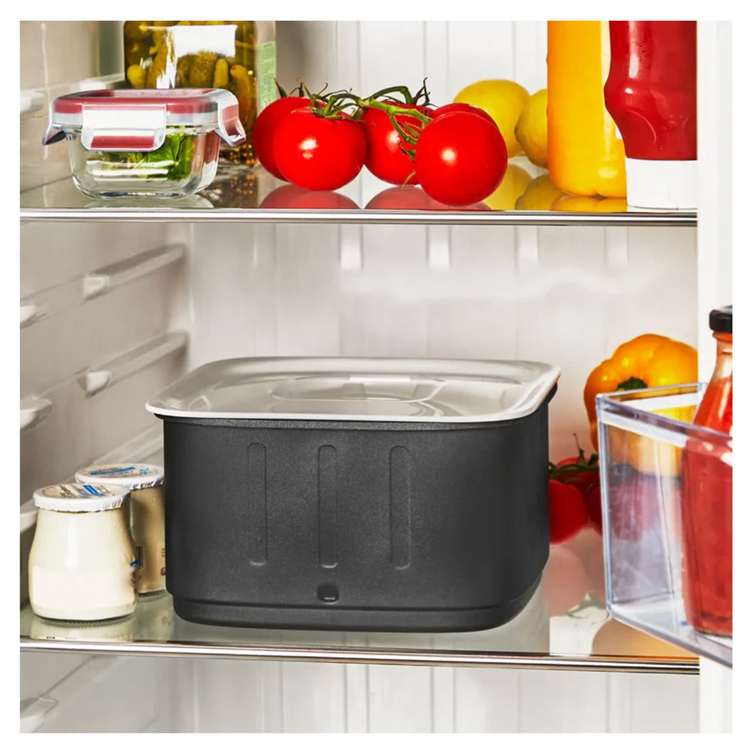 Air fryer in a fridge with food items on shelves