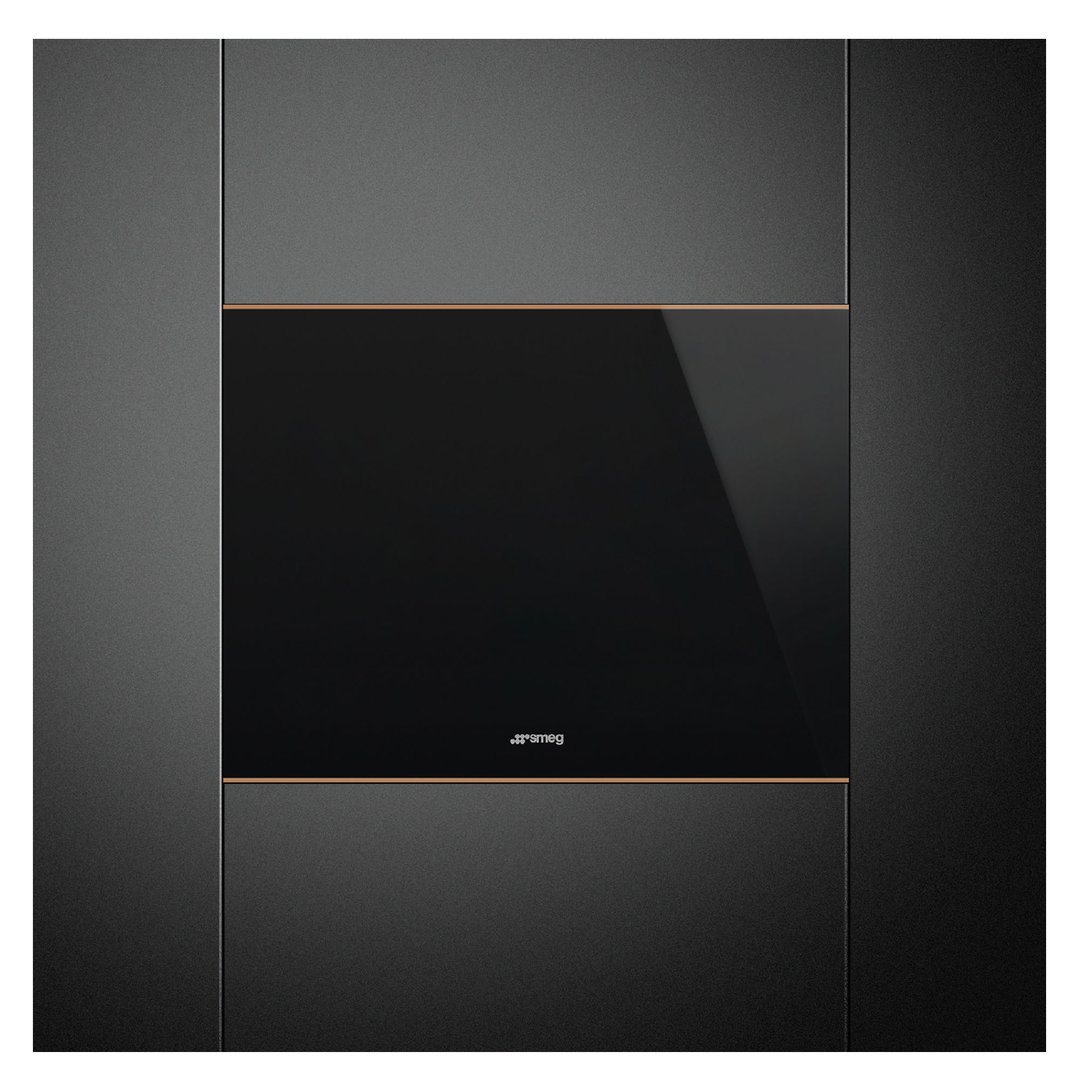 Black built-in wine cooler with copper trim in a dark kitchen setting