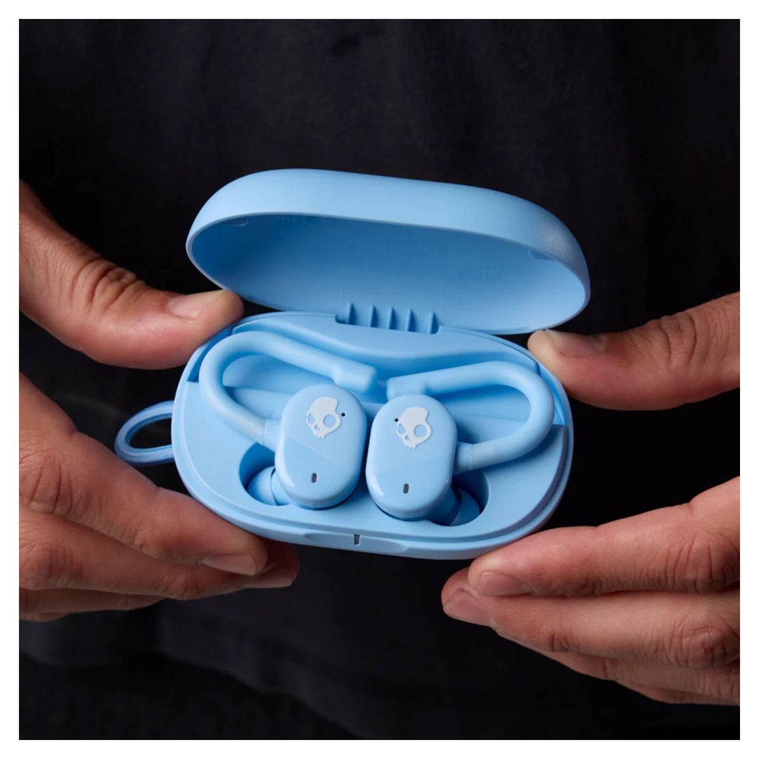Hands holding an open light blue Skullcandy Push Play Active TWS In-Ear headset case