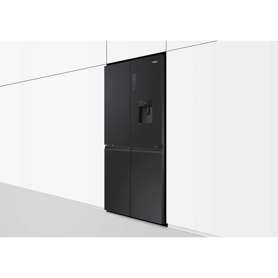 Black Haier Quad Door Refrigerator Freezer with water dispenser in a modern kitchen