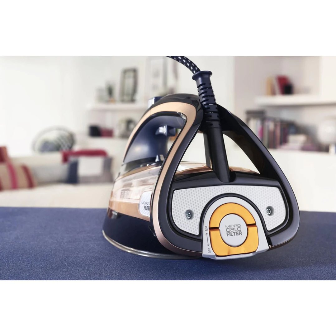 Tefal Ultimate Pure Anti-Calc Steam Iron on a blue surface in a room