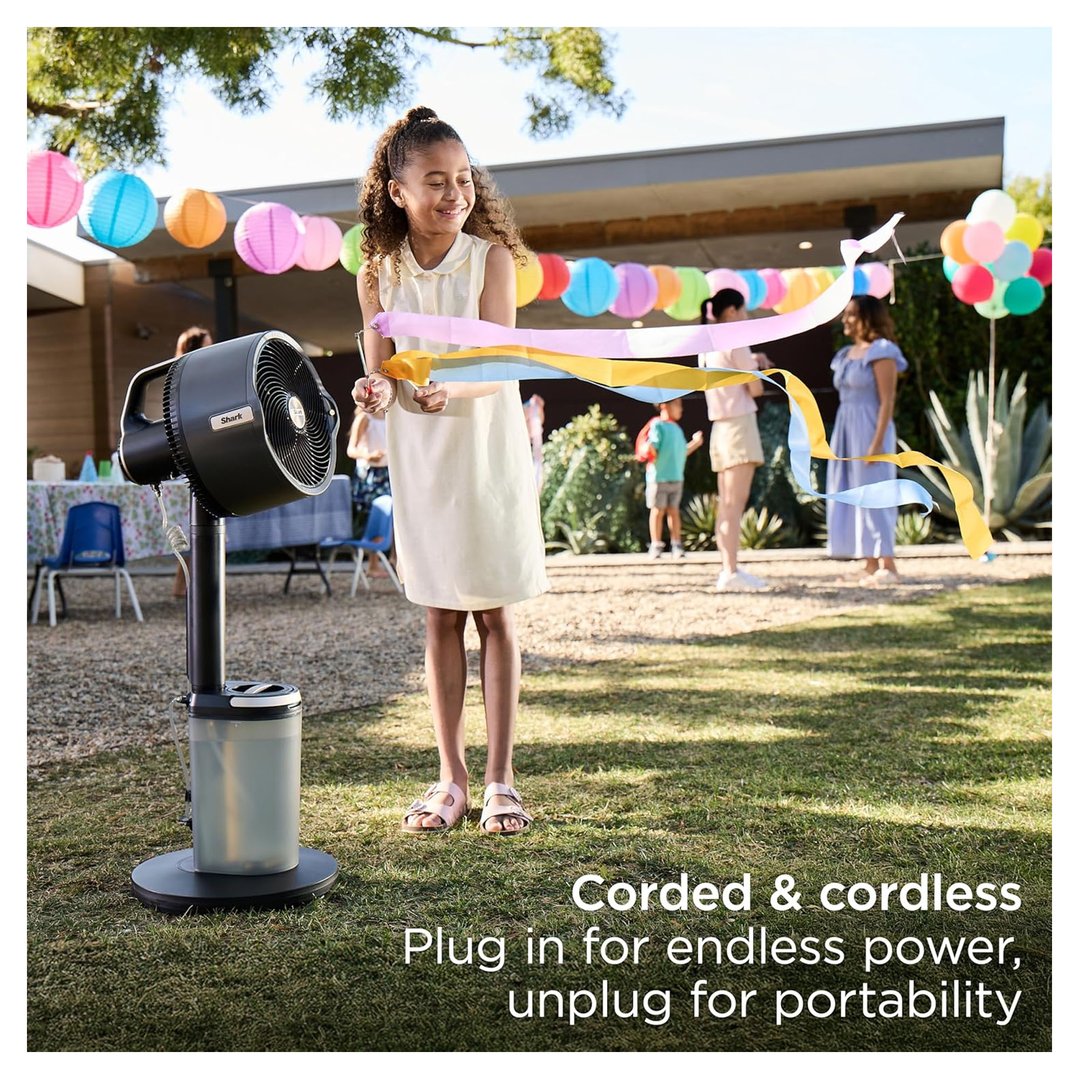 A girl playing with ribbons in front of a Shark FlexBreeze fan outdoors