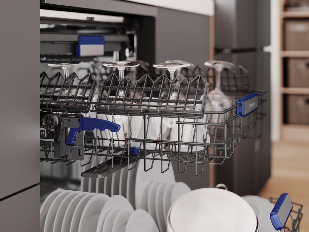 Close up of a dishwasher interior with dishes and glasses inside