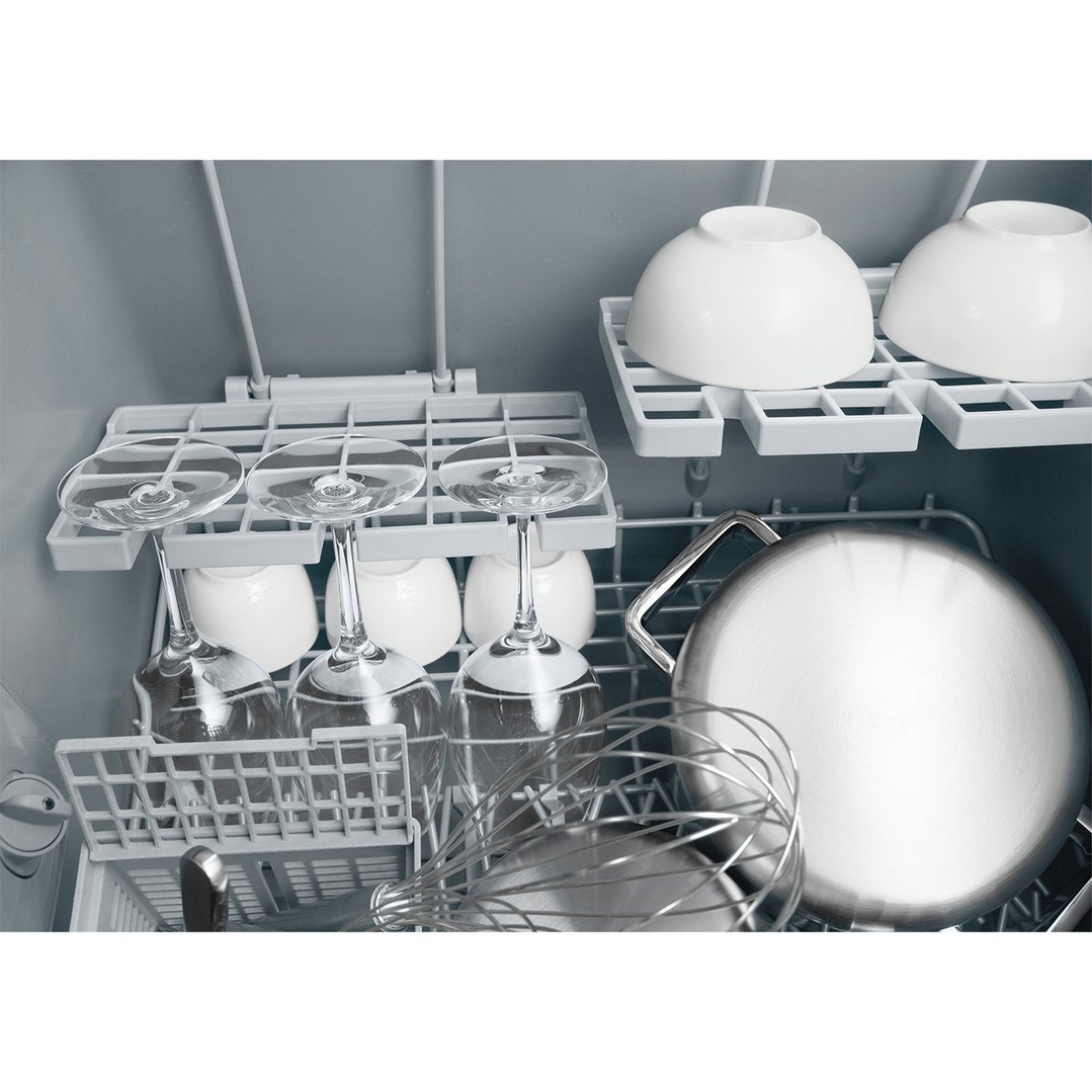 Close up of a dishwasher drawer filled with dishes, glasses, and bowls