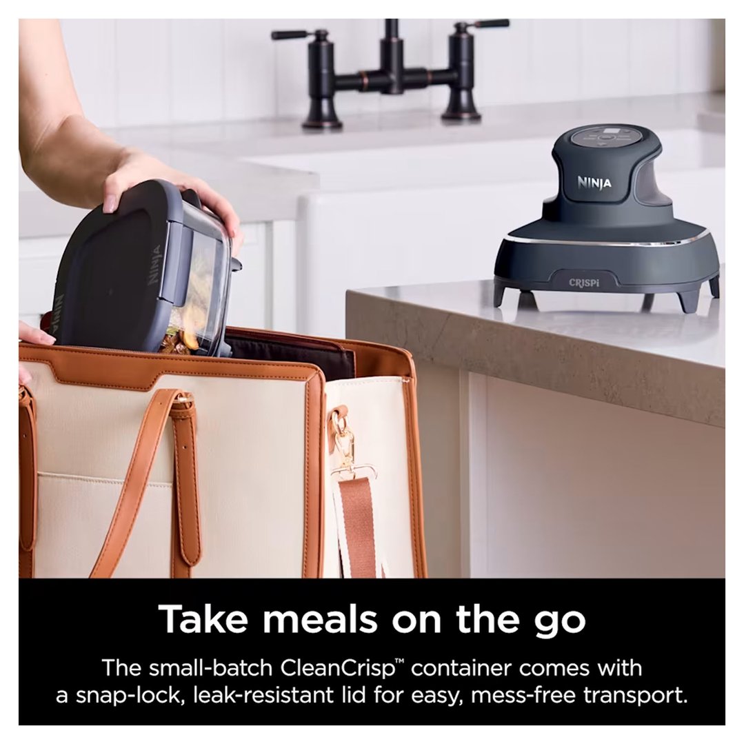 Person placing a Ninja Crispi air fryer container into a tote bag