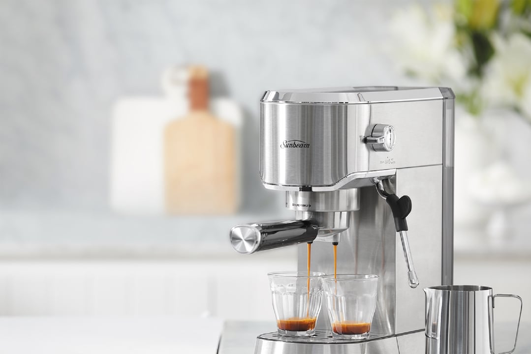 Sunbeam Compact Barista Espresso Machine dispensing coffee into two small glasses