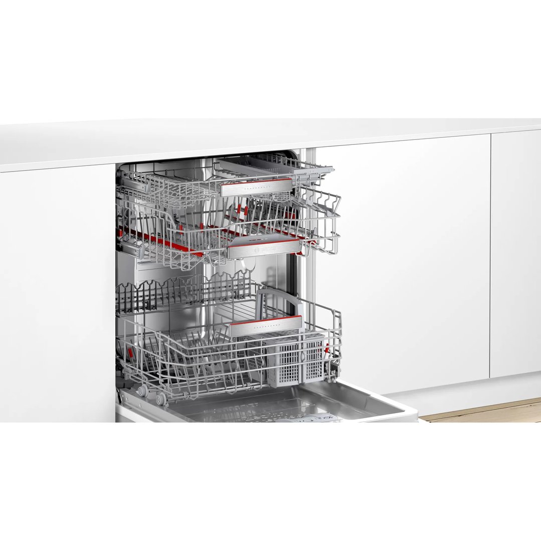 Open dishwasher with racks pulled out, integrated into a white kitchen cabinet