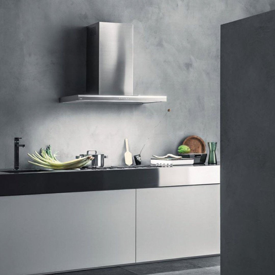 Stainless steel rangehood mounted above a cooktop in a modern kitchen setting
