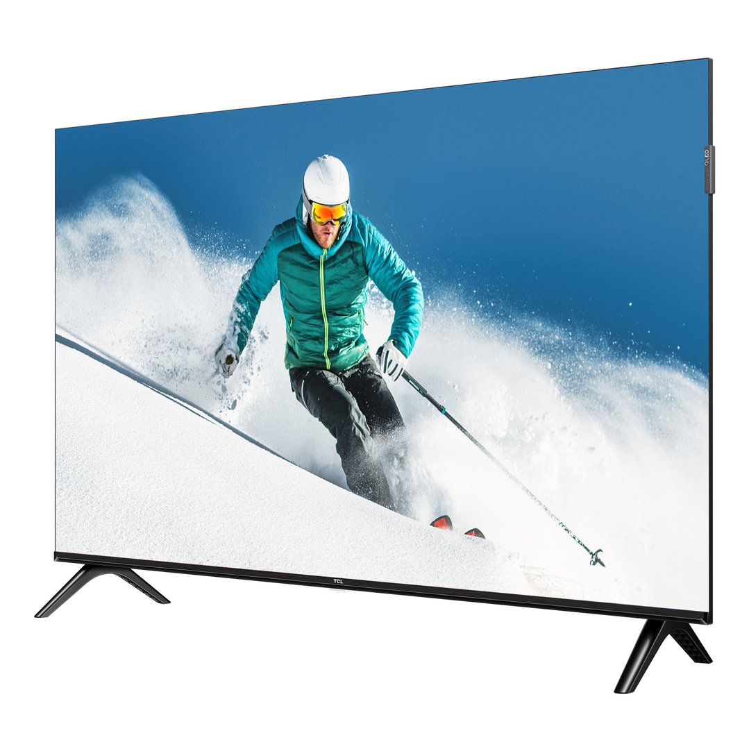 TCL TV displaying a skier on a snowy mountain against a blue sky