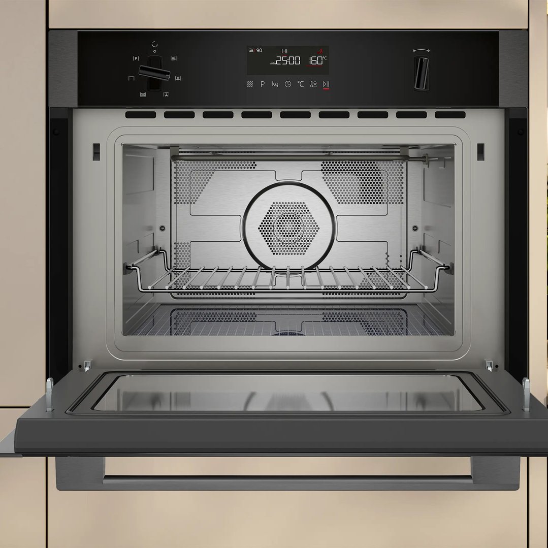 Built-in microwave oven with hot air, door open, showing interior and controls